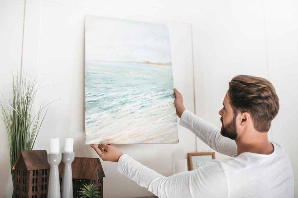 hanging picture on wall