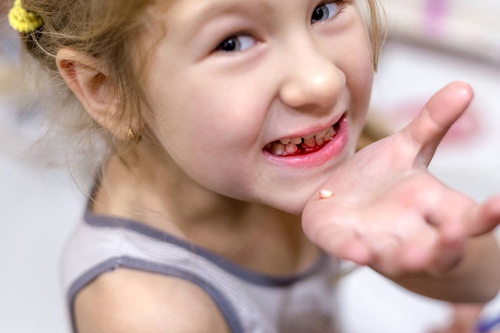 losing first milk tooth