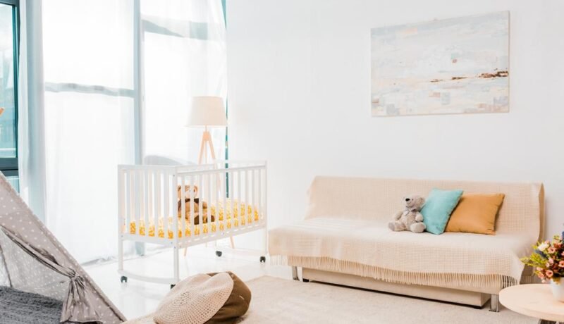 Modern interior design of nursing room with crib
